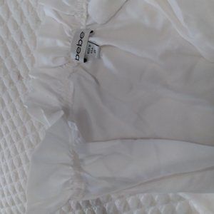 BEBE white top with ruffled neck line